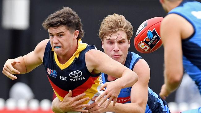 Sturt's Sam Colqhoun tackles Adelaide's Ned McHenry. Picture: Tom Huntley