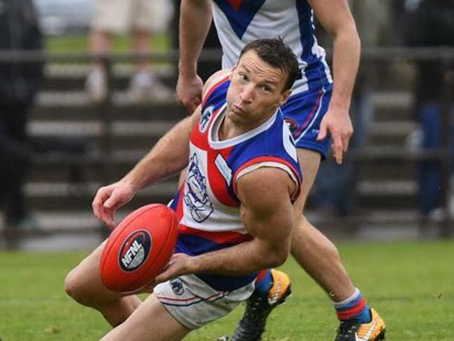 Brent Harvey dishes out a handball for North Heidelberg. Picture: Nathan William Media