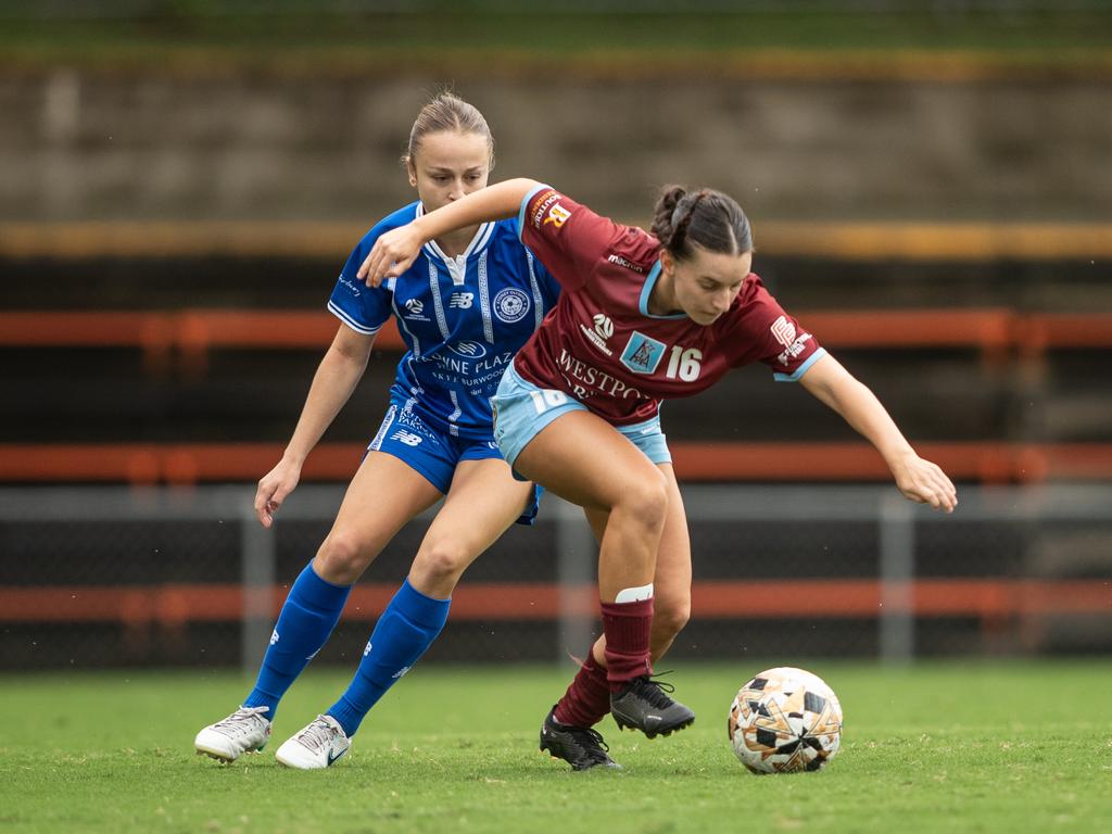 Priya Sciuriaga fighting for the ball against APIA’s Estelle Fragale. Picture: Julian Andrews