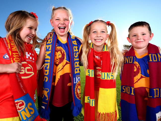 AFL fans Matilda Mooney 5, Amelia Shelton 7, Bronte Mooney 7 and Harley Shelton 5 will get plenty of footy to watch with all the Melbourne clubs in Qld as well as having their own clubs the Suns and Lions at home all the time. Pics Adam Head