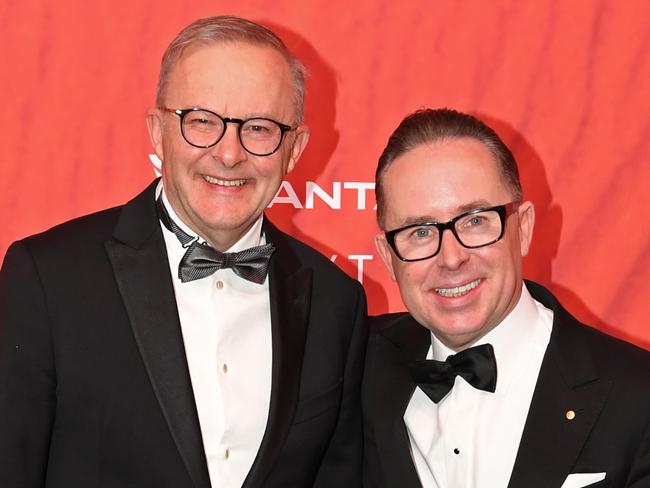 SYDNEY, AUSTRALIA - MARCH 31: Australian Prime Minister Anthony Albanese (L) stands with Qantas CEO Alan Joyce as they attend the Qantas 100th Gala Dinner at Jetbase 96 hangar at Sydney's International Airport on March 31, 2023 in Sydney, Australia. (Photo by James D. Morgan/Getty Images)