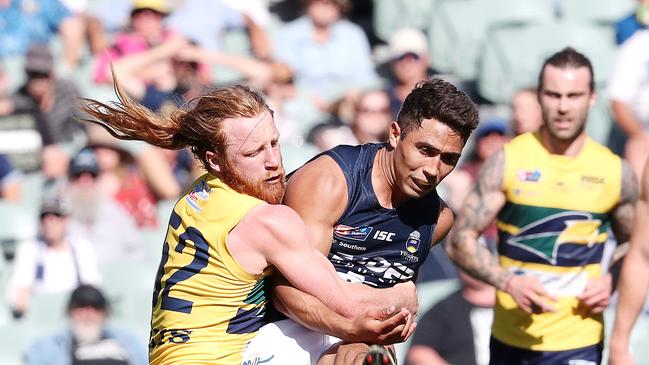 Former South Adelaide gun Malcolm Karpany and Eagles’ Angus Poole. Picture: Sarah Reed