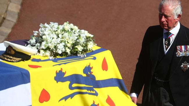 Prince Charles walks with his father’s coffin during the funeral procession. Picture: AFP.