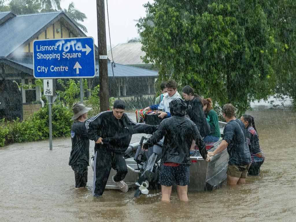 A boatd is used to ferry people from rising waters. Picture: Media Mode