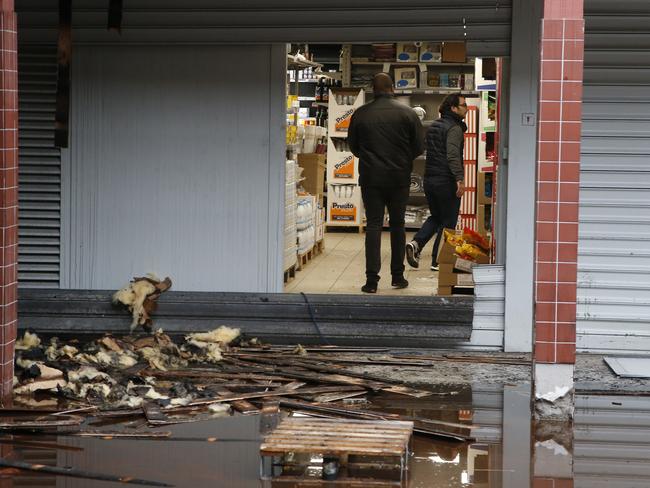 People in a kosher market after it was damaged in an arson attack in Creteil, south of Paris. Picture: AP Photo/Michel Euler