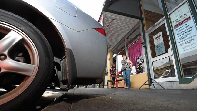 Little Delhi co-owners Chris and Gail Warid are concerned by the lack of space on the footpath when cars overstep the car park in front of their store along Carrington Street. Picture: Marc Stapelberg