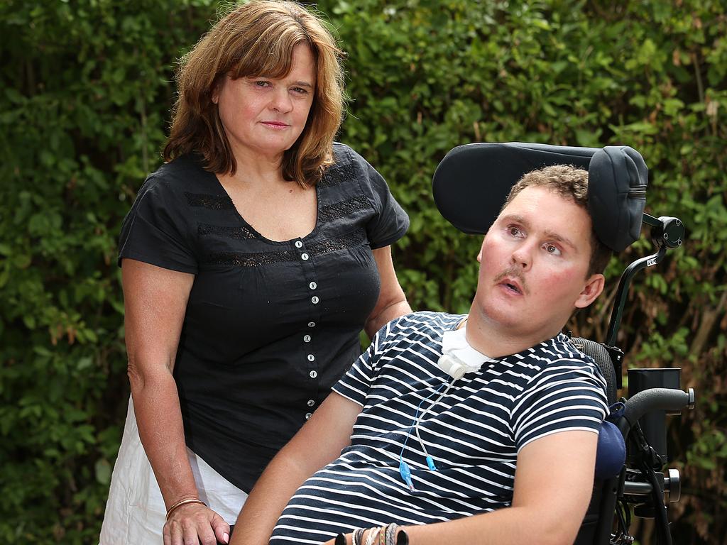 Sam with his mother Katie after rat lungworm from the slug caused meningitis and left him severely disabled.