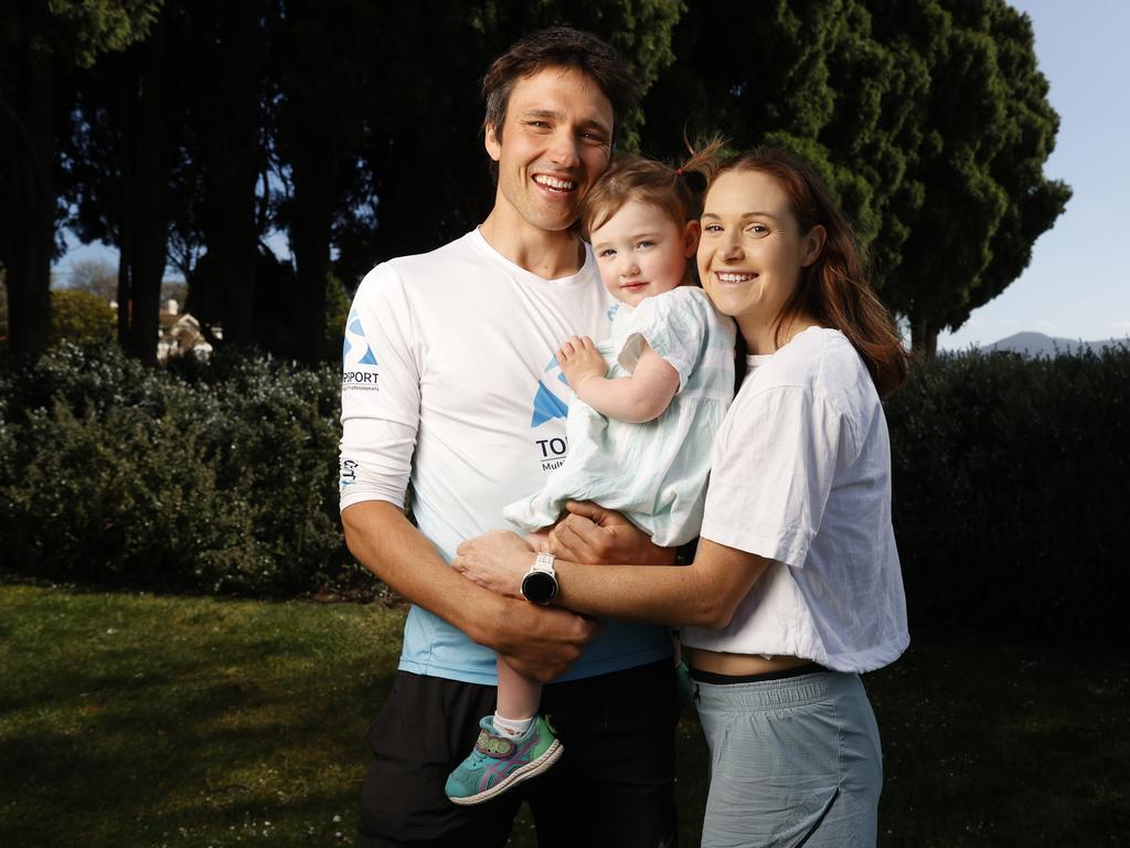 Maggie Lennox with daughter Peggy, 2, and partner Alex Hunt. Maggie Lennox will compete in the Golden Trail World Series in Switzerland. Picture: Nikki Davis-Jones