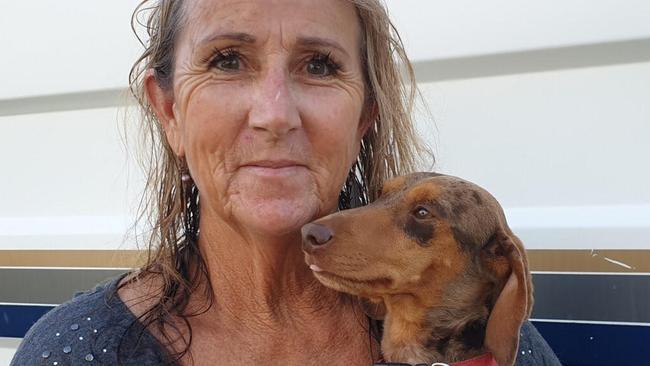 Rosewood dog breeder Sharyn Beed with her dog Elvis after he was returned to her safely.