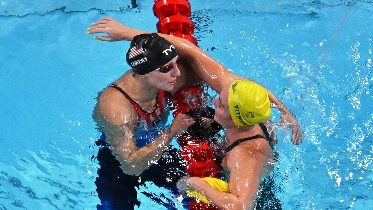 Katie Ledecky (left) shares a moment with Australia's Ariarne Titmus after winning the 800m final. Picture: Jonathan Nackstrand / AFP)