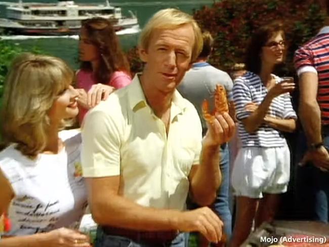 Paul Hogan putting another shrimp on the barbie in the celebrated 1984 Tourism Australia ads. Picture: YouTube