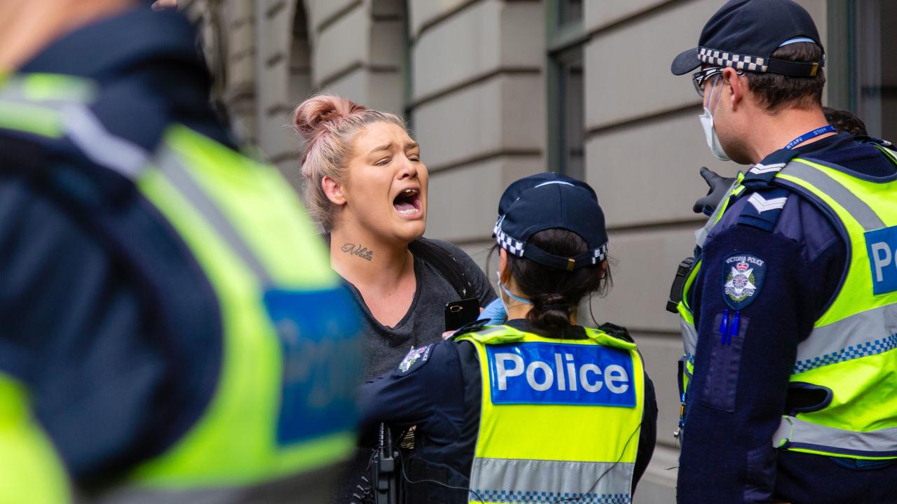 A woman screams as her partner is arrested. Picture: Speed Media/Shutterstock