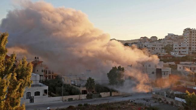 A building that belonged to a Palestinian suspected of carrying out a drive-by shooting attack on an Israeli student is imploded by Israeli forces. Picture: AFP