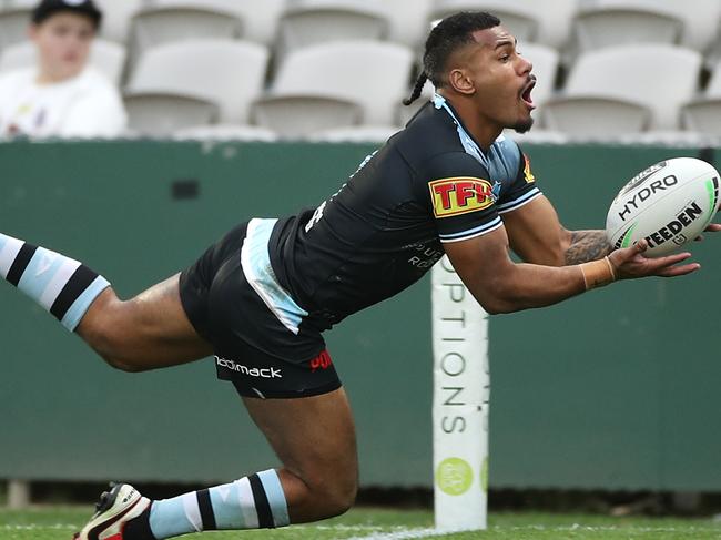 SYDNEY, AUSTRALIA - AUGUST 15: Sione Katoa of the Sharks scores a try during the round 14 NRL match between the Cronulla Sharks and the Gold Coast Titans at Netstrata Jubilee Stadium on August 15, 2020 in Sydney, Australia. (Photo by Mark Kolbe/Getty Images)