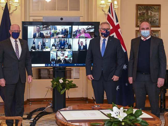 CANBERRA, AUSTRALIA - NewsWire Photos JULY 2, 2021:  Deputy Prime Minister of Australia, Barnaby Joyce and  the Prime Minister of Australia, Scott Morrison and The Governor-General, His Excellency General the Honourable David Hurley AC DSC (Retd), conducts a swearing-in ceremony at Government House in Canberra. Picture: NCA NewsWire / Martin Ollman