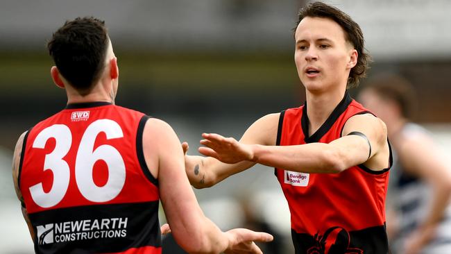 Nathan Rayment of Romsey is congratulated by team mates after kicking a goal during the round 16 Riddell District Football Netball League 2023 Bendigo Bank Seniors match between Romsey and Macedon at Romsey Park in Romsey, Victoria on August 5, 2023. (Photo by Josh Chadwick)