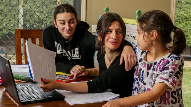 Mary Papadakis is teaching her own class, as well as supervising her young daughters Zoe and Evie. Picture: Tim Carrafa