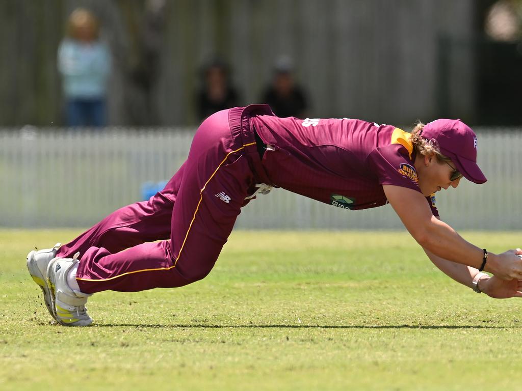 GOLD COAST, AUSTRALIA - OCTOBER 03: Laura Harris of Queensland catches out Olivia Porter of ACT during the WNCL match between Queensland and the Australian Capital Territory at Bill Pippen Oval, on October 03, 2022, in Gold Coast, Australia. (Photo by Albert Perez/Getty Images)
