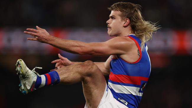 MELBOURNE, AUSTRALIA - July 21, 2023. AFL .        Bulldog Bailey Smith kicks at goal during the round 19 match between Essendon and Western Bulldogs at Marvel Stadium on July 21, 2023, in Melbourne, Australia. Photo by Michael Klein.