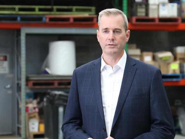 Transport and Infrastructure Minister Michael Ferguson speaks to the media at Tasmanian Shipping Supplies in Hobart on Wednesday, March 22, 2023.