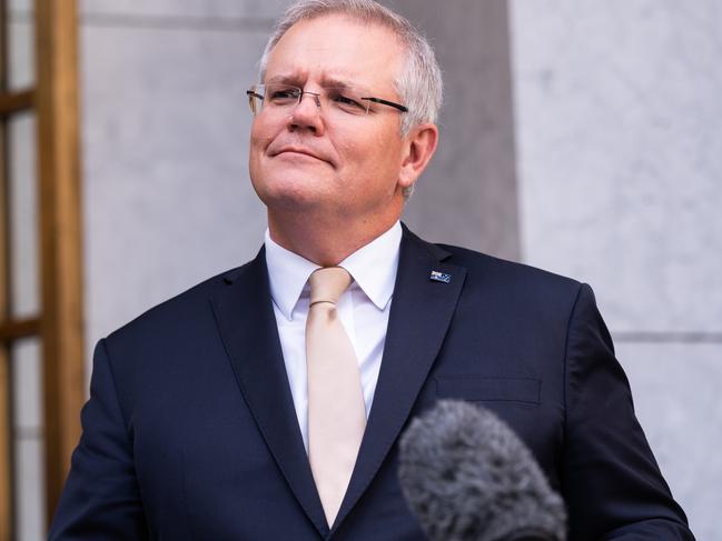 CANBERRA, AUSTRALIA - MAY 08: Prime Minister Scott Morrison speaks during a press conference following a National Cabinet meeting on May 8, 2020 in Canberra, Australia. Prime Minister Scott Morrison has outline a new plan agreed to by the National Cabinet to start easing restrictions imposed in response to the COVID-19 pandemic. The three-step plan aims to deliver a "COVID-19 safe economy" by allowing restaurants and cafes to reopen, then allowing 20-person gatherings before later loosening restrictions to allow 100-person gatherings and interstate travel. Individual state and territory governments will be in charge how quickly they move through the stages based on the status of the disease. (Photo by Rohan Thomson/Getty Images)