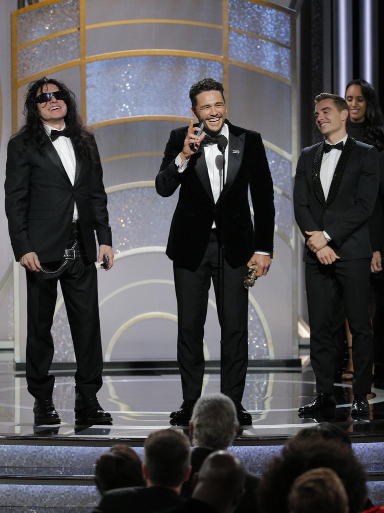 James Franco, with Tommy Wiseau and Dave Franco, accepts the award for Best Performance by an Actor in a Motion Picture Musical or Comedy for The Disaster Artist during the 75th Annual Golden Globe Awards. Picture: Getty