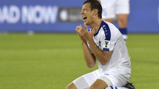 Uzbekistan's defender Gurbangeldi Batyrov reacts during his side’s loss to Japan. Picture: AFP