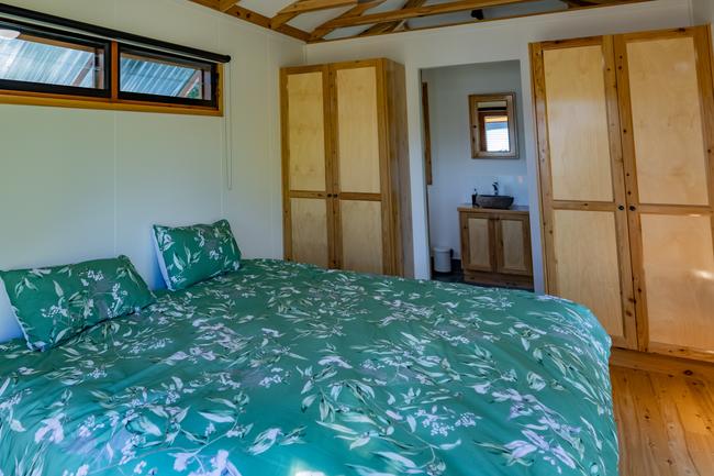 The Mount Jukes Eco Resort, built from scratch by yoga aficionado David Deakin, holds glamping tents and a half-moon shaped house that face Mt Jukes and Mr Deakin says the â€œenergyâ€ of the property has to be experienced to be understood. Picture: Contributed