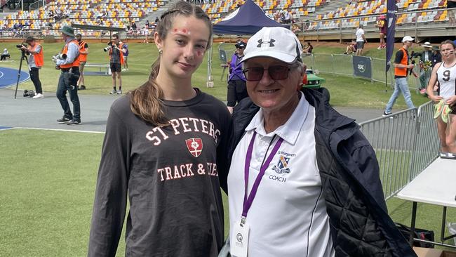 St Peters record breaker Brogan Tomich ran into her club coach, Eric Brown.