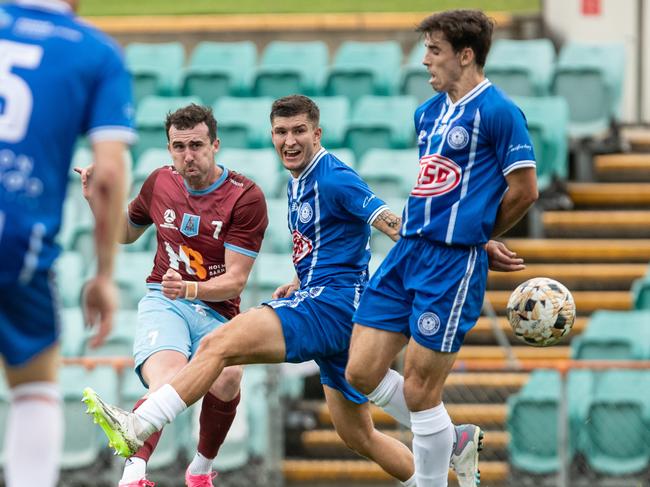 Jack Stewart slides the ball past the Olympic defence for a second APIA goal. Picture: Julian Andrews