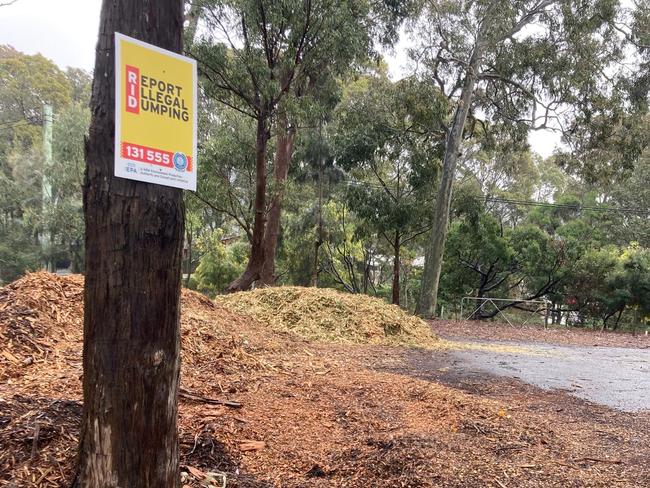 The brazen dumping of mulch at the cemetery despite a sign urging people to report illegal dumping. Picture: supplied