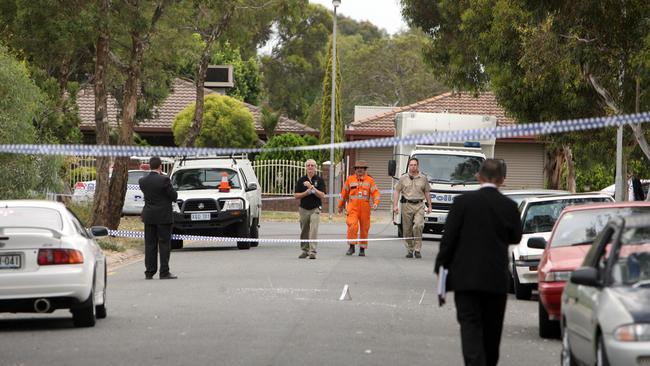 Police officers investigating Mr Kheav’s murder in 2007.