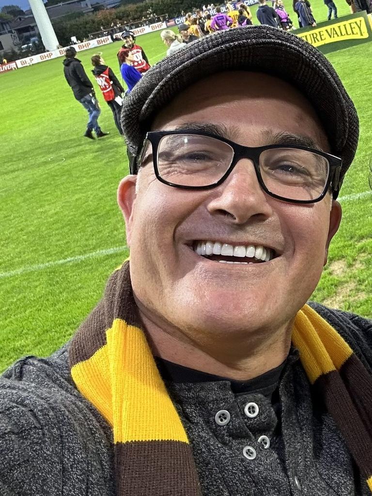 Former Deputy Premier James Merlino in his Hawthorn scarf.