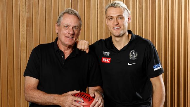 Collingwood and Melbourne legend Peter Moore with his son, current Magpies captain Darcy, on Sunday. Picture: Michael Willson / Getty Images