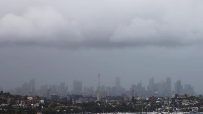 A storm moves in over Sydney from the south dropping rain & lightning .picture John Grainger