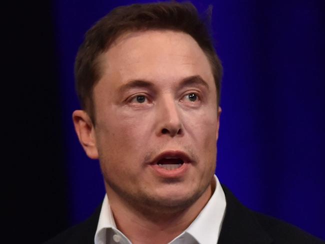 (FILES) File photo dated September 29, 2017 shows billionaire entrepreneur and founder of SpaceX Elon Musk speaking at the 68th International Astronautical Congress 2017 in Adelaide.  The world's biggest battery was officially launched in Australia on December 1, 2017, with the Elon Musk-driven project powered up early to meet peak demand amid a bout of hot weather, officials said. / AFP PHOTO / PETER PARKS
