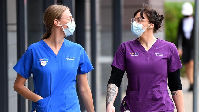 Hospital nurses wear face masks during the first day the COVID-19 lockdown in Brisbane. Picture: NCA NewsWire/Dan Peled