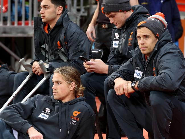 SYDNEY, AUSTRALIA - JULY 15:  Injuired Giants players (L-R) Stephen Coniglio, Harrison Himmelberg, Tim Taranto, Jacob Hopper and Brett Deledio of the Giants look on during the round 17 AFL match between the Greater Western Sydney Giants and the Sydney Swans at Spotless Stadium on July 15, 2017 in Sydney, Australia.  (Photo by Ryan Pierse/Getty Images)