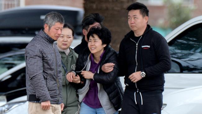 The woman’s family arrive at Altona Beach on Sunday. Picture: Andrew Henshaw