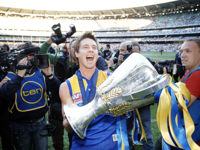 Cousins with the Eagles’ premiership cup in 2006.