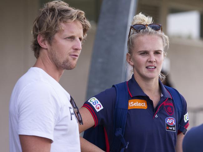 Shae Sloane of the Demons (right) and her brother Rory Sloane of the Adelaide Crows are seen after the Round 1 AFLW match between Melbourne and Fremantle at Casey Fields in Melbourne, Sunday, February 3, 2019. (AAP Image/Daniel Pockett) NO ARCHIVING, EDITORIAL USE ONLY