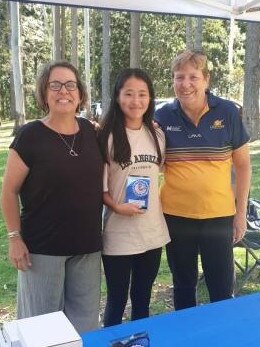 Charlett Ost (middle) from the Gympie and District Netball Association.