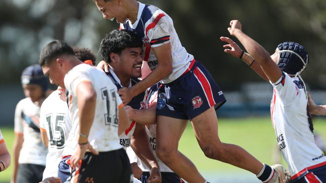 The Roosters celebrating Blessing Foini’s try. Picture: Sue Graham