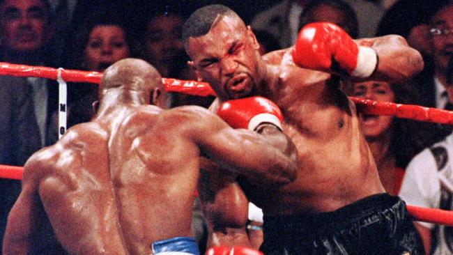 Holyfield lands a right hand on Tyson in their first fight. Picture: AFP