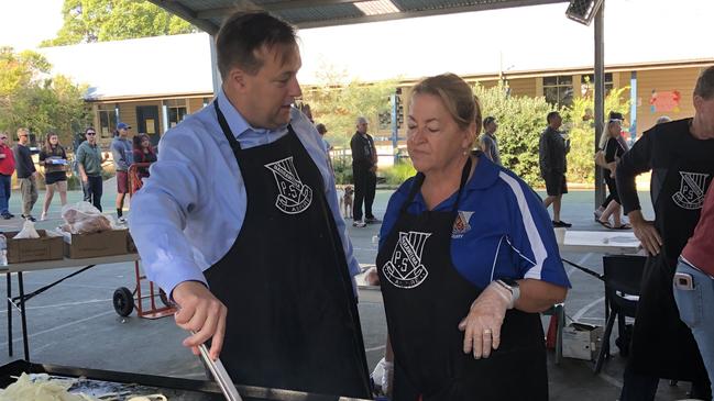 MP for Mackellar Jason Falinski helps Narraweena Public School principal Sally Bell.