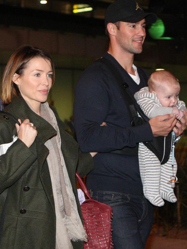 The couple with Ethan in returning home to Melbourne in 2010.