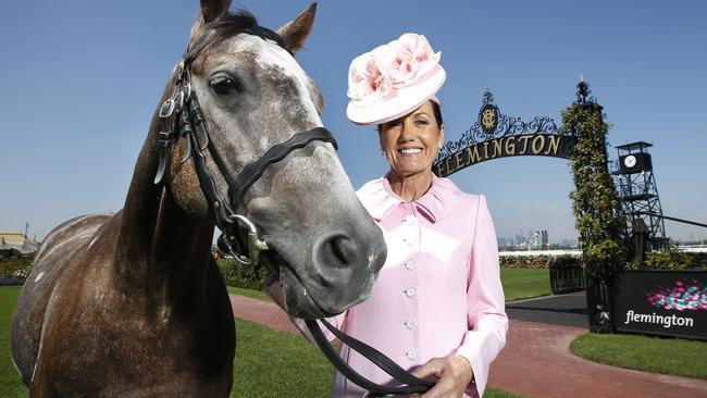 New VRC chairman Amanda Elliott with clerk of the course horse Bryan at Flemington. Picture: David Caird