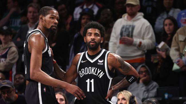 NEW YORK, NEW YORK - APRIL 23:  Kevin Durant #7 and Kyrie Irving #11 of the Brooklyn Nets look on in the final seconds of their 109-103 loss against the Boston Celtics during Game Three of the Eastern Conference First Round NBA Playoffs at Barclays Center on April 23, 2022 in New York City.  NOTE TO USER: User expressly acknowledges and agrees that, by downloading and or using this photograph, User is consenting to the terms and conditions of the Getty Images License Agreement.  (Photo by Al Bello/Getty Images).