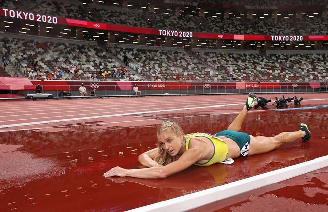 Heartbreaking scenes as Genevieve Gregson of Team Australia lays injured during the Women's 3000m Steeplechase final. Picture: David Ramos/Getty Images