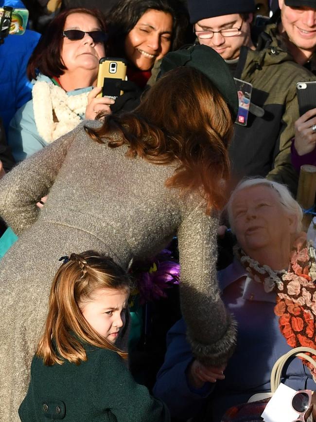 Princess Charlotte amd her mothe rKate greet well-wishers after the Christmas Day service. Picture: AFP.